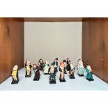 A collection of fifteen small Royal Doulton Dickensian figures, comprising, ‘Oliver Twist’, ‘Fagin’,