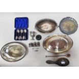 A small collection of assorted silver comprising a small trophy, a trowel bookmark, a three piece