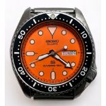 A vintage Seiko Quartz SQ Divers 150m stainless steel wristwatch, the orange enamel dial with dot