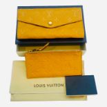 A Louis Vuitton Sarah Monogram Empreinte leather portfolio wallet, saffron yellow colour, gold