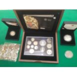 Various coins, including a 2009 UK proof coin set in its original display case, a 2008 Queen