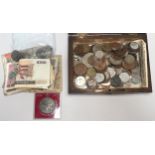 A collection of assorted circulated GB and world coinage and banknotes including shillings,