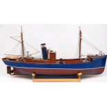 Three model boats on stands, built from scale model kits and fitted with motors, comprising a 1: