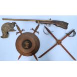 A collection of assorted decorative wall ornaments made from reproduction weaponry, to include a