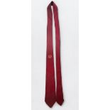 A red tie, believed to have previously belonged to Portsmouth FC legend, former player and