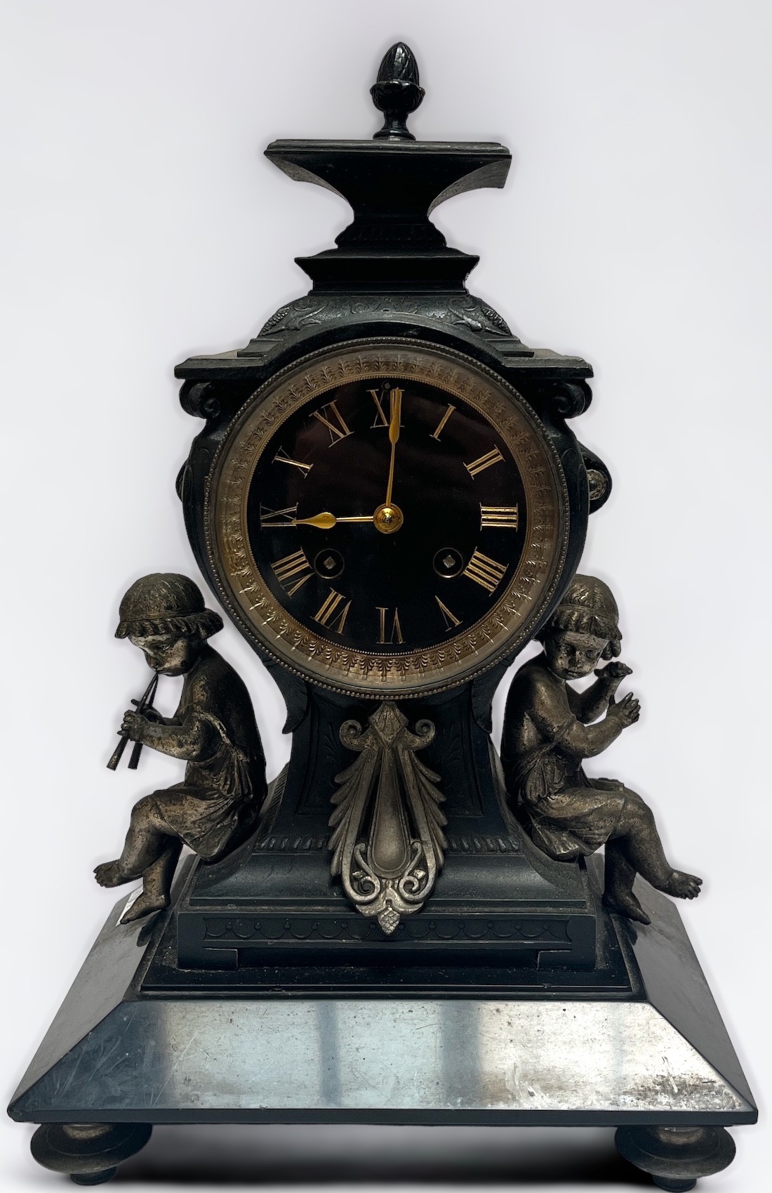 A 19th Century cast metal and black slate mantel clock of inverted square baluster form, the eight-
