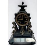 A 19th Century cast metal and black slate mantel clock of inverted square baluster form, the eight-