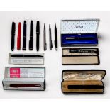 A collection of thirteen various writing instruments such as fountain pens, pencils, ballpoint pens,