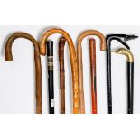 Nine various walking sticks comprising a 19th Century French Swordstick, the 61cm flattened square-