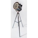 An adjustable chrome searchlight/standard lamp, with barrel light fitting and frosted glass front,