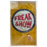 A vintage hand-painted canvas carnival/circus sign reading ‘Freak Show’ with a hand pointing, glazed
