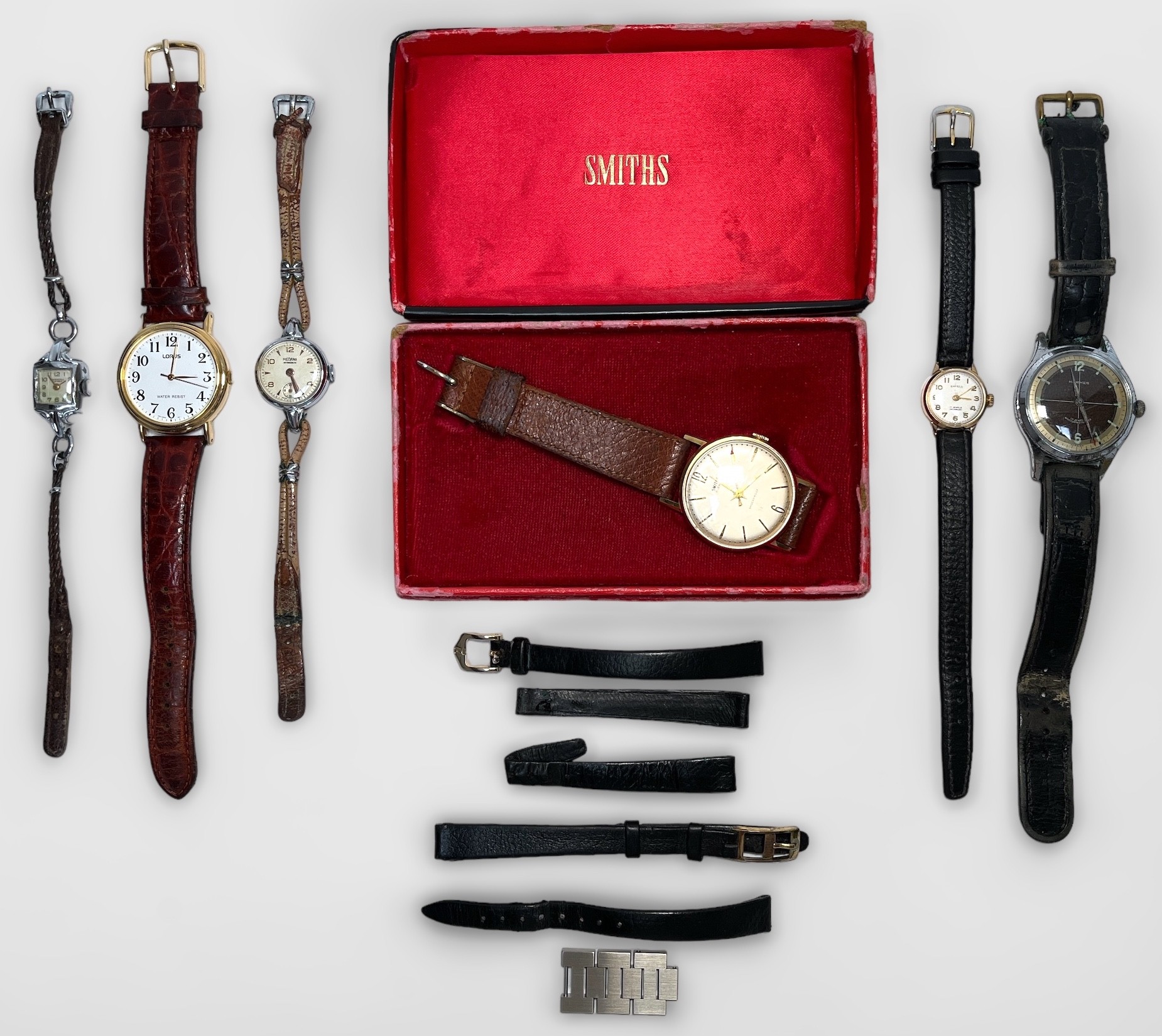 A collection of assorted wristwatches comprising a gold-plated Smiths example, boxed, a gents