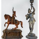 A painted and patinated cast spelter figure of Joan of Arc on horse and gothic style platform