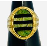 A 9ct ring, set with an oval hardstone of green and black striped design, 7.3 grams gross.