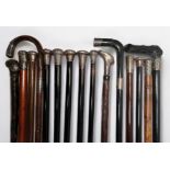 Fifteen various silver-topped nd white-metal topped walking canes comprising, an Ebony walking