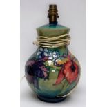 A Moorcroft pottery 'Orchids pattern' baluster table lamp, 27cm high