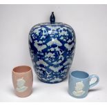 A large Chinese blue ground porcelain ovoid jar and cover, decorated with butterflies, 30cm high,