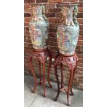 A pair of large 20th century famille rose baluster vases, each decorated in Canton enamels with