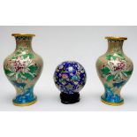 A pair of Chinese Cloisonne enamel vases with flowers to a cream cloud-scroll ground, 25cm