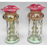 A pair of 19th century Bohemian opaque white glass lustre vases with pink cased glass shaped rims,