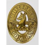 A solid cast brass oval Whitbread sign, 33cm