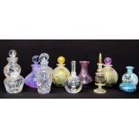 A collection of eleven perfume bottles including isle of Wight Glass, Orrefors, Murano and Waterford