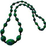 An Art Deco style Venetian glass bead necklace, graduated, measuring approximately 28 inches.