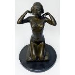 Aldo Vitaleh, patinated bronze figure of a female nude kneeling on a pillow, on circular black