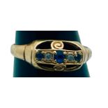 An 18ct yellow gold gypsy style ring, set with 3 x faceted sapphires, and 2 x old cut diamonds, ring