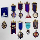 Three various enamel and silver-gilt Masonic medals / jewels and ribbons comprising, Manchester