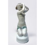 A Rosenthal porcelain kneeling figure of “Ariadne” by Ariane Caasmann, in rarer colourway, 15cm high