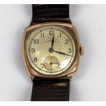 A vintage 9ct gold cushion cased wristwatch, C.1947, the gilt dial with Arabic numerals denoting