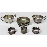 Three silver napkin rings, gross weight approximately 2.8ozt, together with three silver-plated