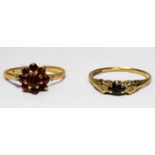 Two various 9ct gold rings, one a garnet coloured cluster ring, the other a three stone ring set