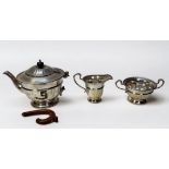A three-piece silver teaset by The Goldsmiths & Silversmiths Company, comprising teapot, two-handled