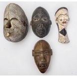 Four African Carved Wooden Tribal Masks, including Bulu Monkey mask, Punde tribe and two others. (4)