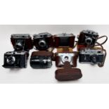Seven assorted cameras and a lens, including, Seagull 203, no. 67950, in fitted leather case with