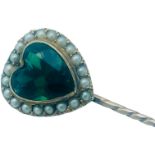 A 15ct gold and 9ct gold stick pin, set with a heart shaped faceted green stone, surrounded by