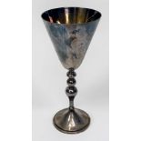 A Silver and silver-gilt goblet, by Asprey, with triple-knopped stem and circular spreading foot,