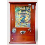 A 2p coin operated ‘Lucky 7’ pinball type amusement arcade machine, in stained wooden case, 75 x