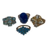 Four various 9ct yellow gold dress rings, all set with blue stones, total weight 18.3 grams.