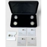 A cased Royal Mint four coin set of UK silver proof £1 coins depicting the four British nation