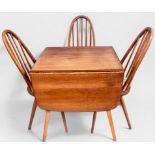 An Ercol blonde elm drop-leaf dining table, of rectangular form, raised on squared, tapering