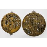 Two various Chinese carved and pierced wooden circular panels, each carved and gilded with