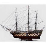A detailed scale wooden model of HMS Victory, the 104-gun First Class Ship-of-the-Line, and Flag