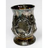 A George III silver tankard by George Smith II, ornately worked in relief with floral decoration,