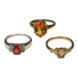 Two 9ct yellow gold dress rings, both set with oval faceted yellow stones, together with a 9ct white