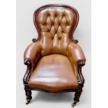 Two similar Victorian mahogany and brown leather spoon back parlour armchairs, deep-button back