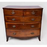 A George III mahogany bow-front chest of two short and three long graduted oak-lined drawers, with