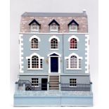 A modern doll's house in the Georgian style, arranged over four floors, together with a good